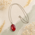 Crimson Eclipse Oval Pendant Necklace